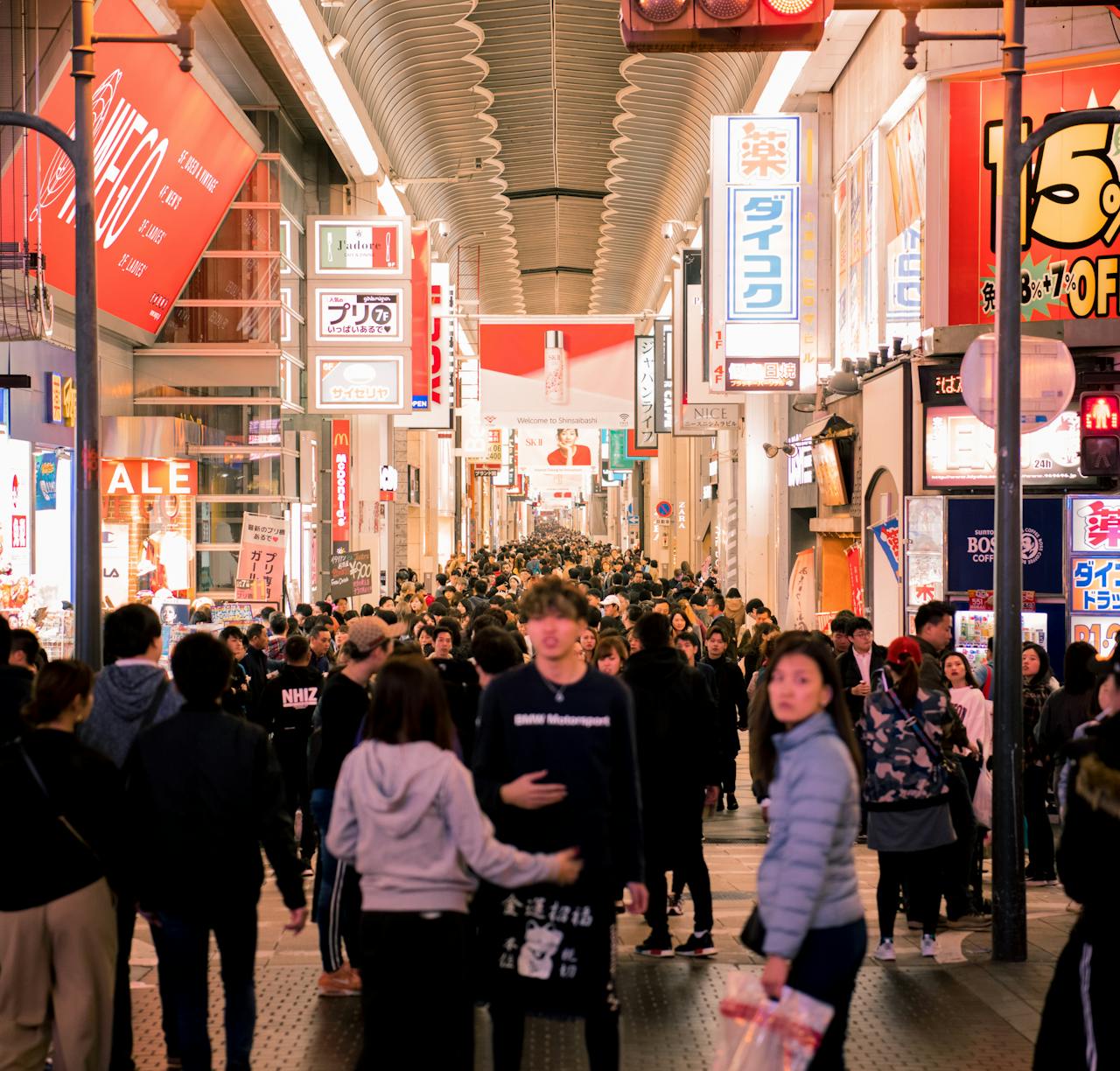Vibrant crowd enjoying shopping and nightlife in Downtown Osaka's famous Dotonbori district.